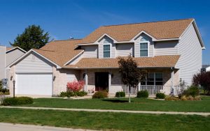 A suburban home with a well-maintained roof, illustrating professional roof repair services.