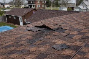 wind lifted shingles on a residential home
